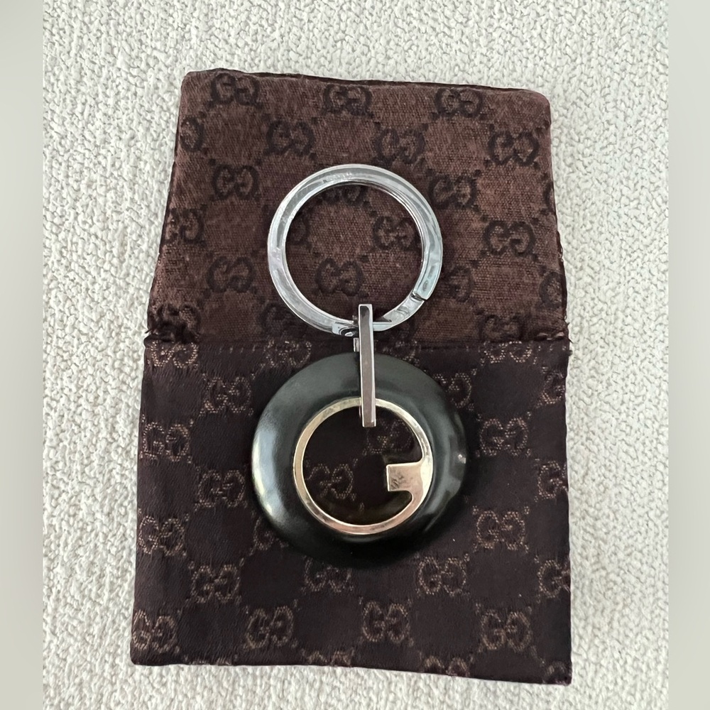 Gucci keychain with iconic G design in Silver 925 and Ebony wood.Brand New.